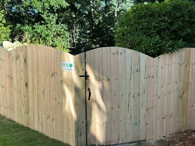 Arched wood privacy fence and gate