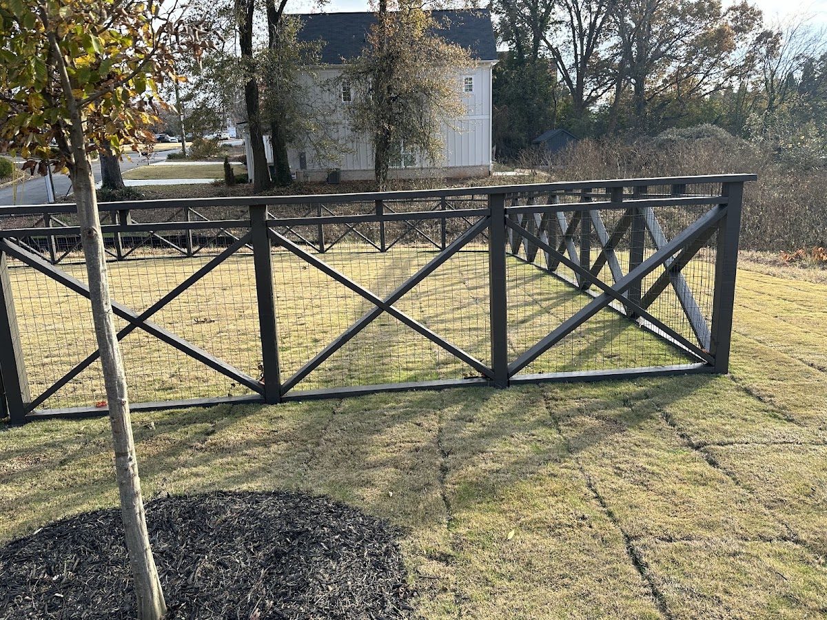 Black ranch rail fence with X panels